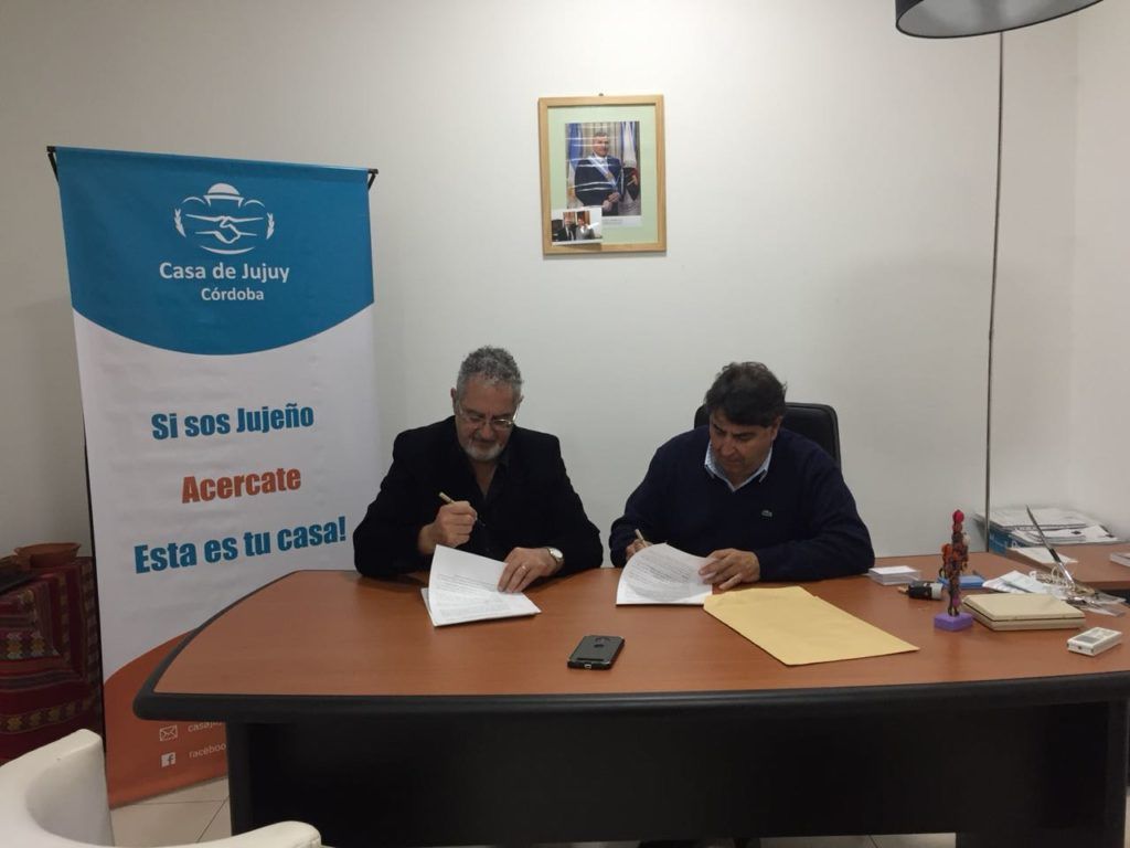 Ministro Bouhid y Alberto del Cura, rubrican el acuerdo. 